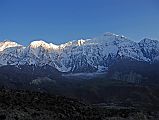 03 Tilicho Peak And Nilgiri North Before Sunset From Kharka On Way To Mesokanto La Tilicho Peak and Nilgiri North shine bright before sunset from our camp on the kharka (3460m) above Jomsom on the way to Tilicho Lake. The Nepalese army restricted military area is across the valley.